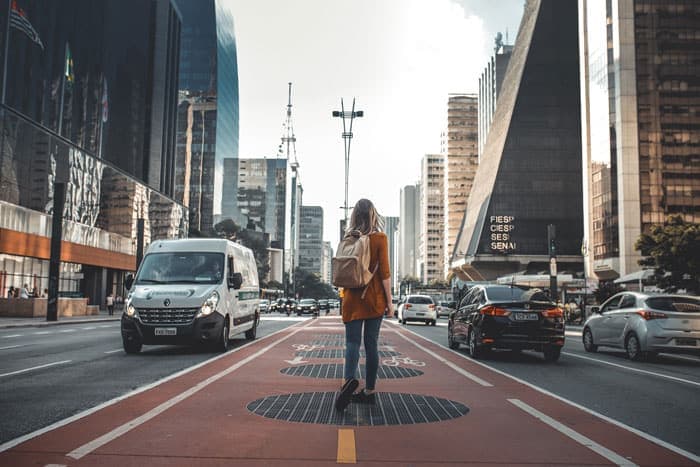 Woman walking at busy Paulista Avenue in São Paulo