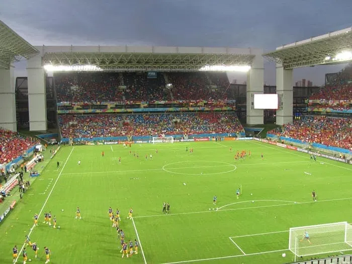 Watching a soccer match in a stadium is an essential Brazil activity