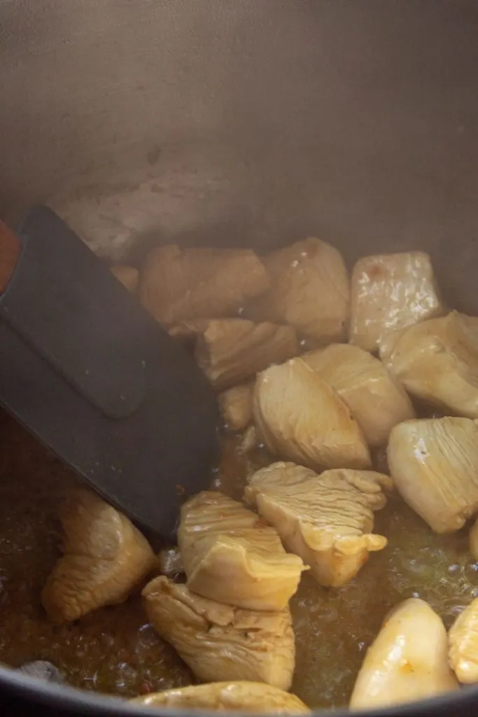 Brazilian chicken and rice cooking