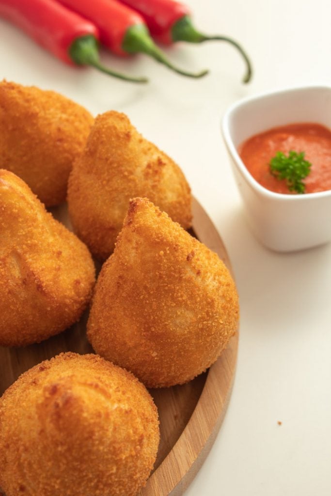 Coxinha de frango with chili sauce