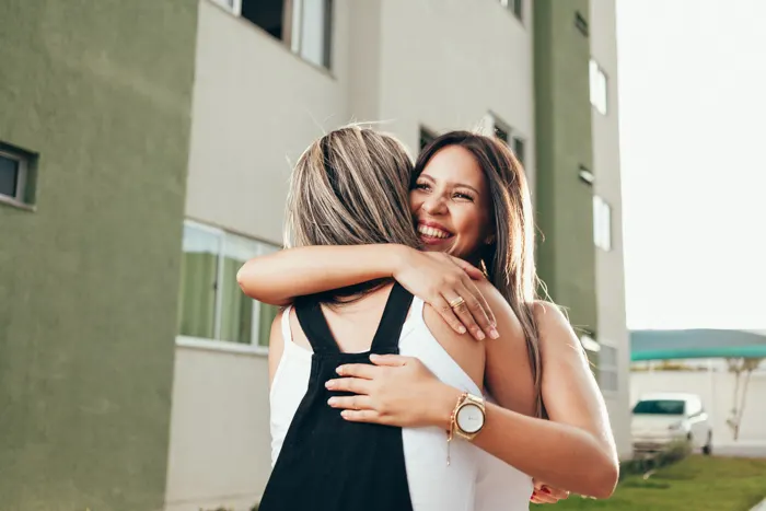 Brazilian friends hugging