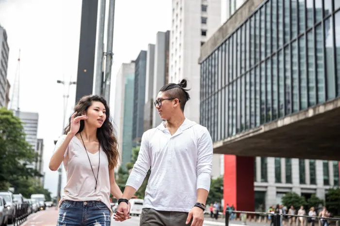 Young Brazilian couple walking at Paulista Avenue in São Paulo