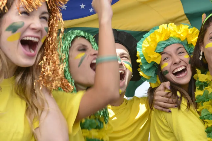 Group of happy Brazilian soccer fans