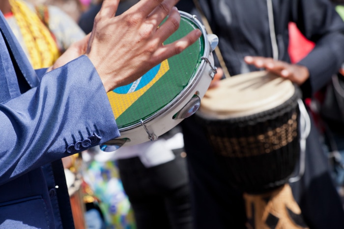 Playing samba on tambourine