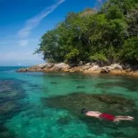 Person snorkeling in Lagoa Azul, Ilha Grande