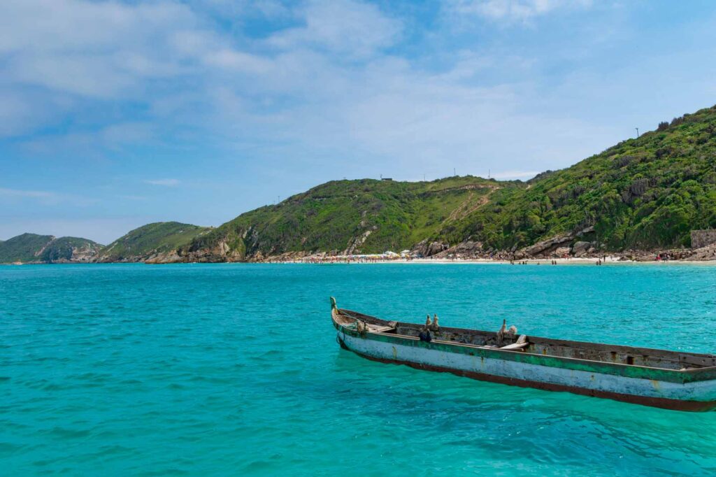 Boat floating on blue water in Arraial do Cabo, Brazil