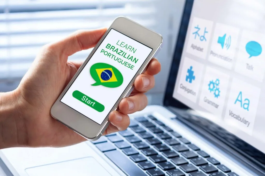 Man holding a mobile and learning Brazilian Portuguese on an app
