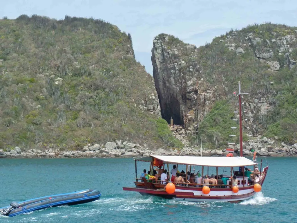 Boat sailing near Our Lady Split in Arraial do Cabo, Brazil