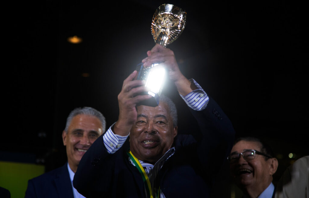 Jairzinho, a Brazilian soccer player, receiving a prize